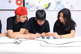 Students actively working in the WhizRobo lab